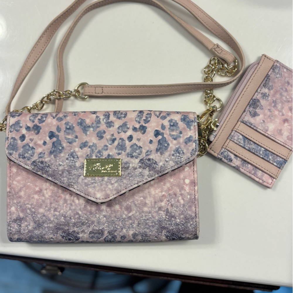 Betsy Johnson Crossbody with pink, purple and light blue details.